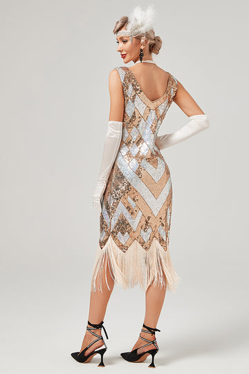 Vestido de lentejuelas doradas de la década de 1920 con flecos